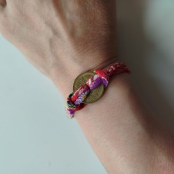 Braccialetto cordonciono e moneta